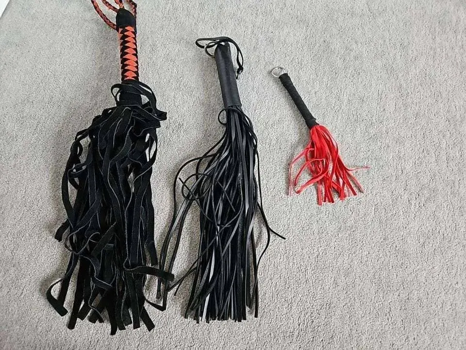 Flogger-style kink tools on a carpet for a guide to fetish-aware communities and FetLife alternatives Flogger-style kink tools on a carpet for a guide to fetish-aware communities and FetLife alternatives